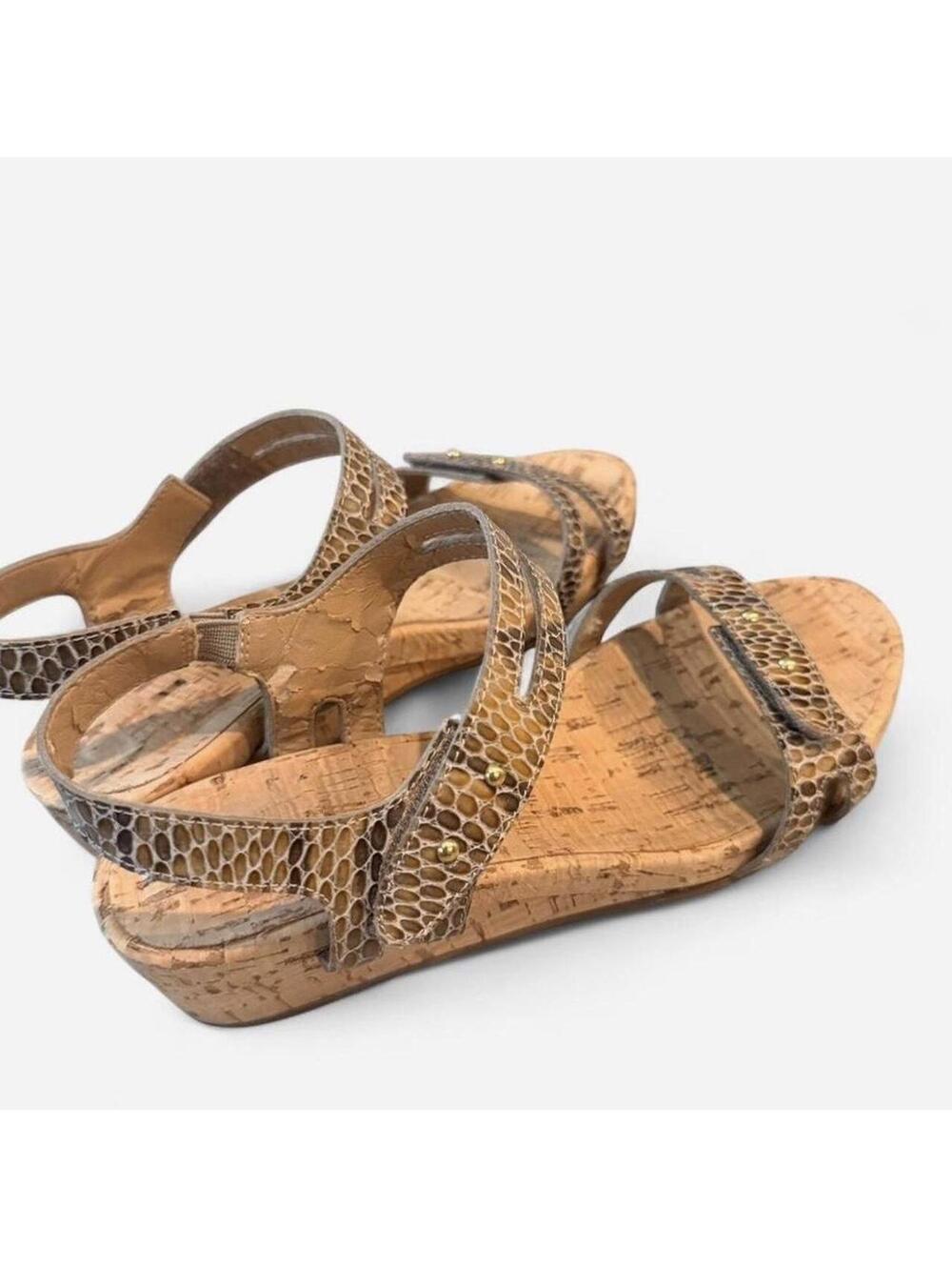 Shimmery snake print with gold embellishments cork baby wedge sandals.